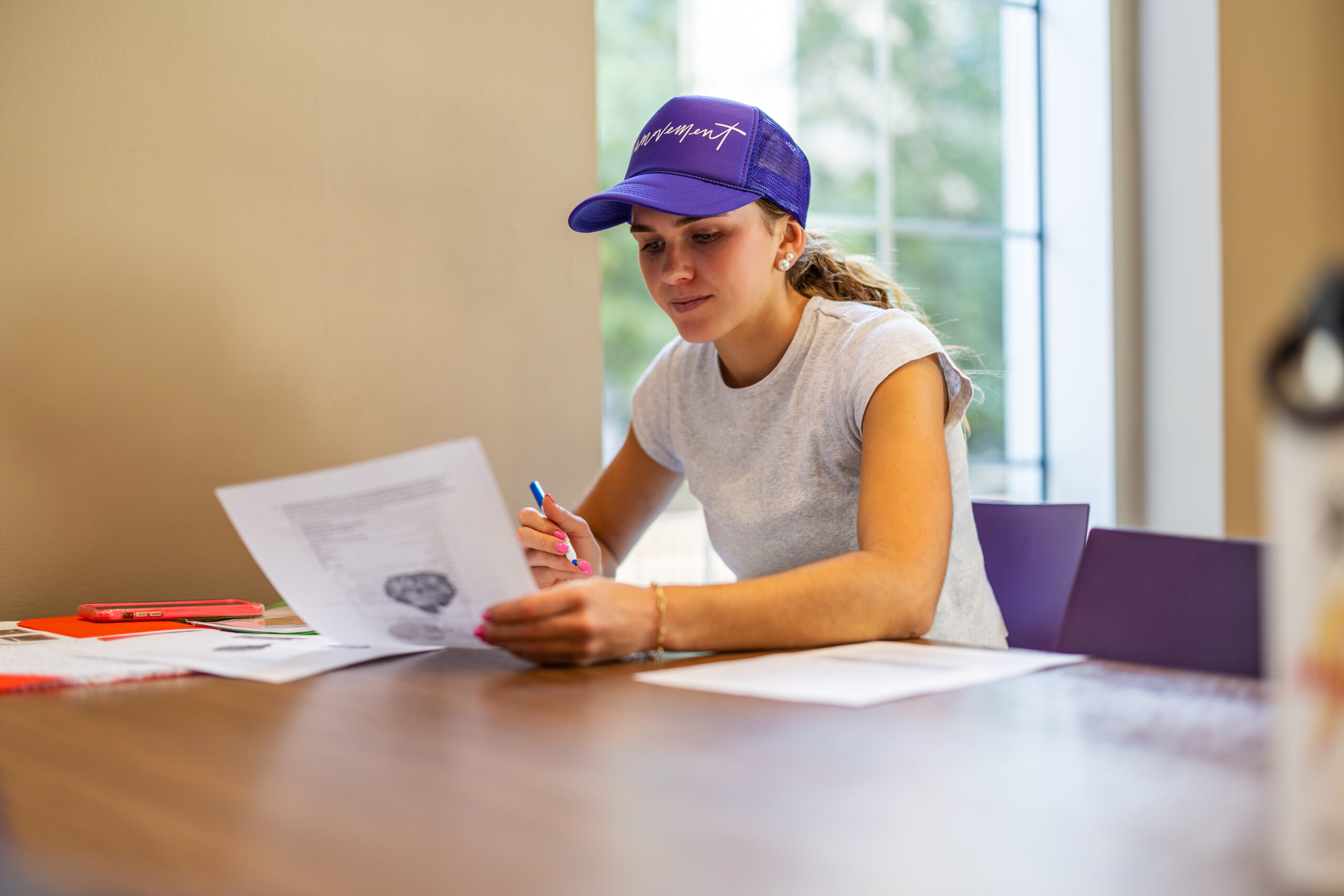 A student studies at a table in the King Family Commons. Photo by James Anger on November 8, 2023.